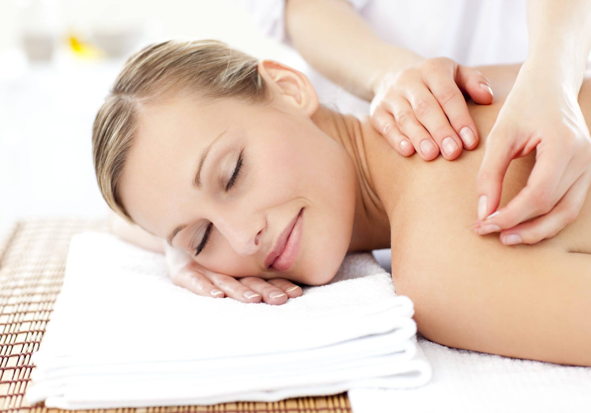 Radiant woman receiving an acupuncture treatment in a health spa