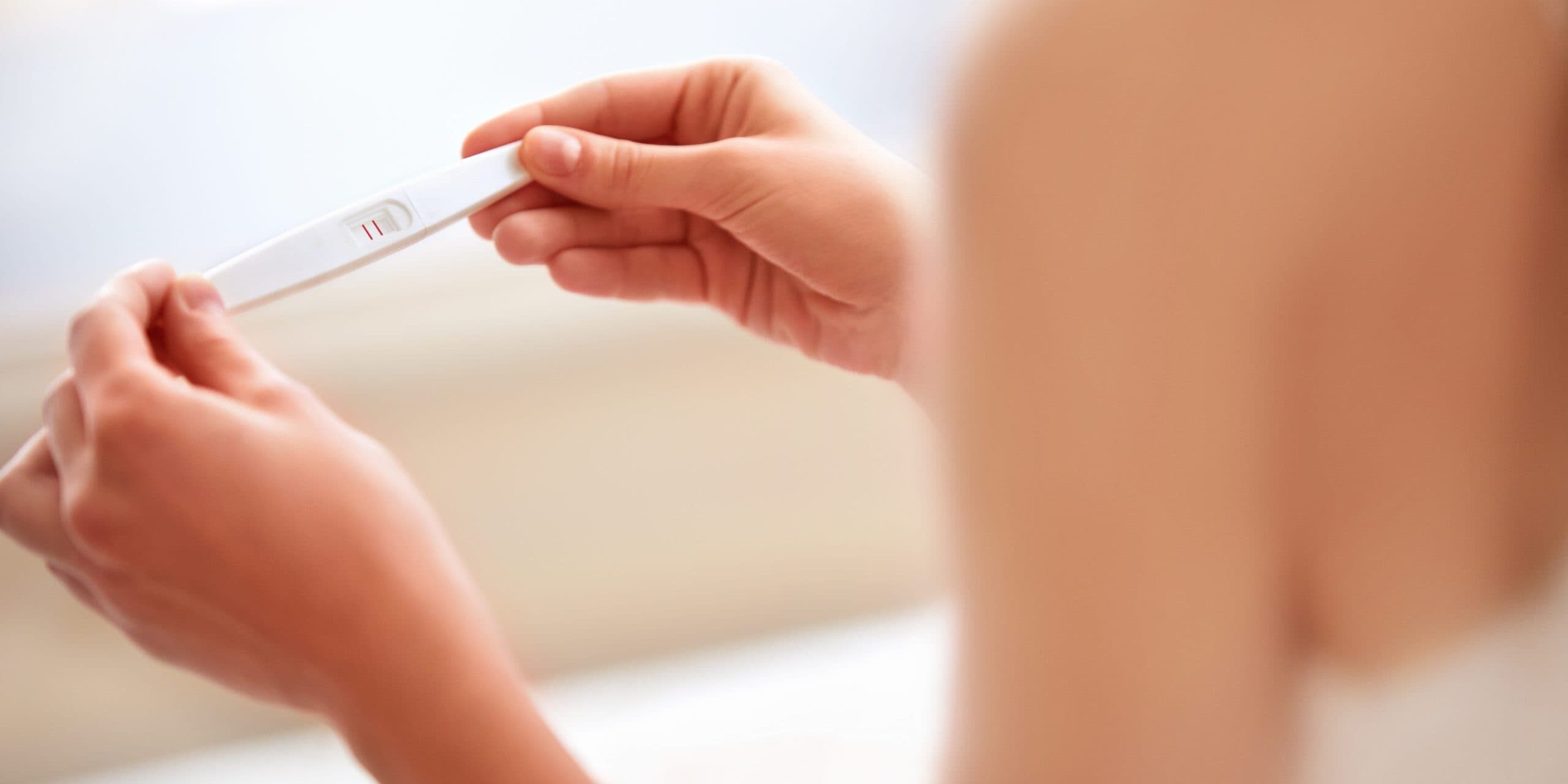 Woman Holding Pregnancy Test